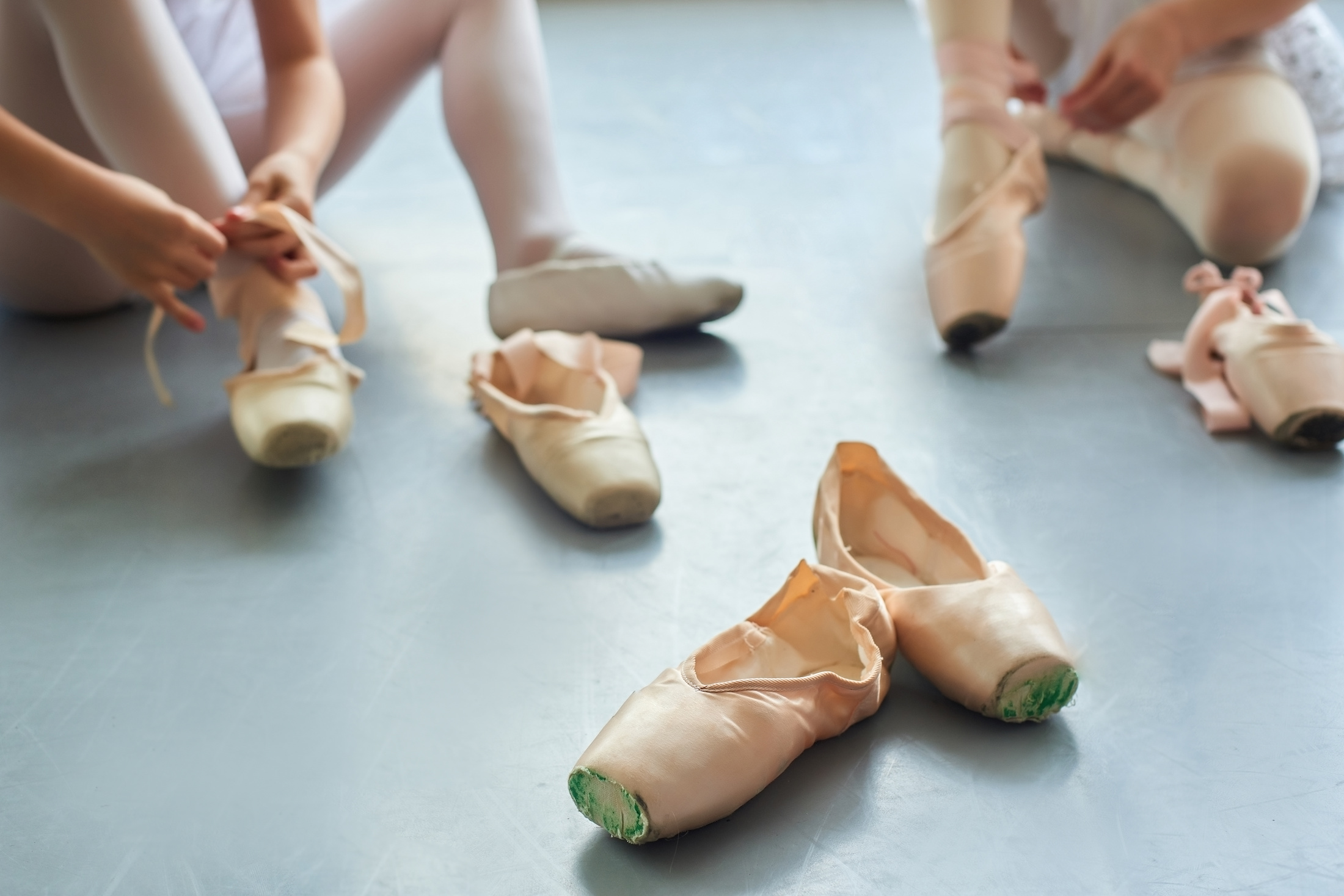 ballet dancers training for pointe shoes by starting on demi pointe